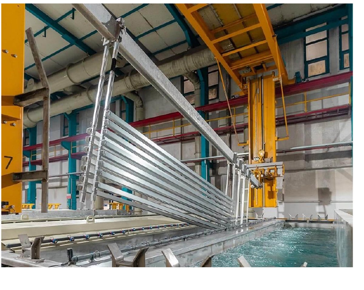 Aluminium sections lowered into the anodizing dip line at New Indira Steels